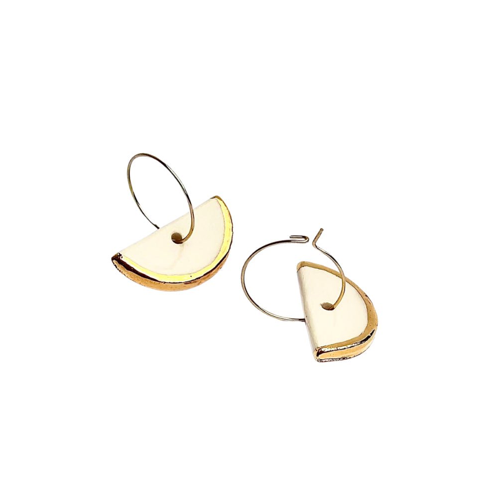 Doraluna | Handcrafted white ceramic dangle earrings with gold luster - Glow