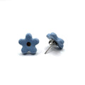Margherita | Handcrafted light blue floral ceramic stud earrings with golden detail - Glow